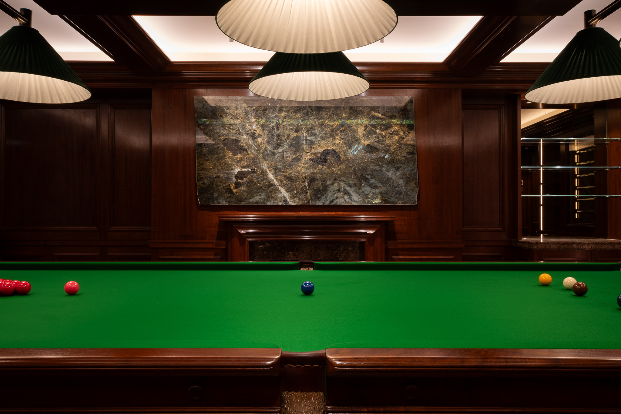 Traditional panelling in african mahoghany for an entertainment soace and gamnes room in a London home by William Garvey Bespoke furniture maker and designer