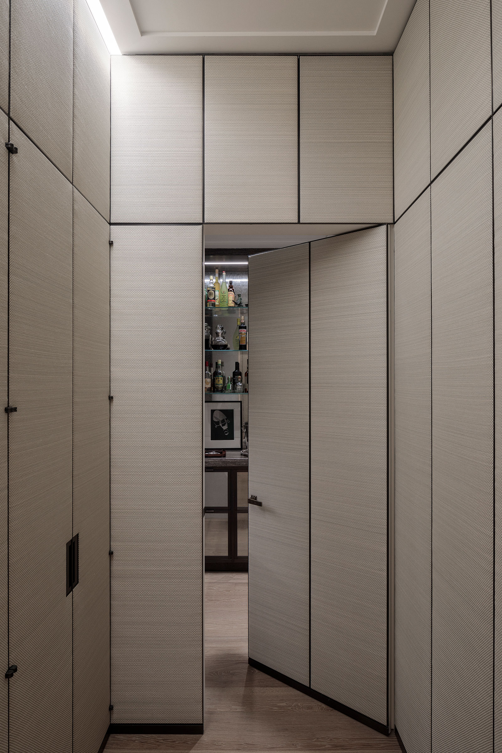 Bespoke horsehair panelling crafted by a local artisan overseen by our project managers and design team. The panels hide away the different rooms of the London duplex apartment. Bespoke craftsmanship by William Garvey Bespoke furniture maker