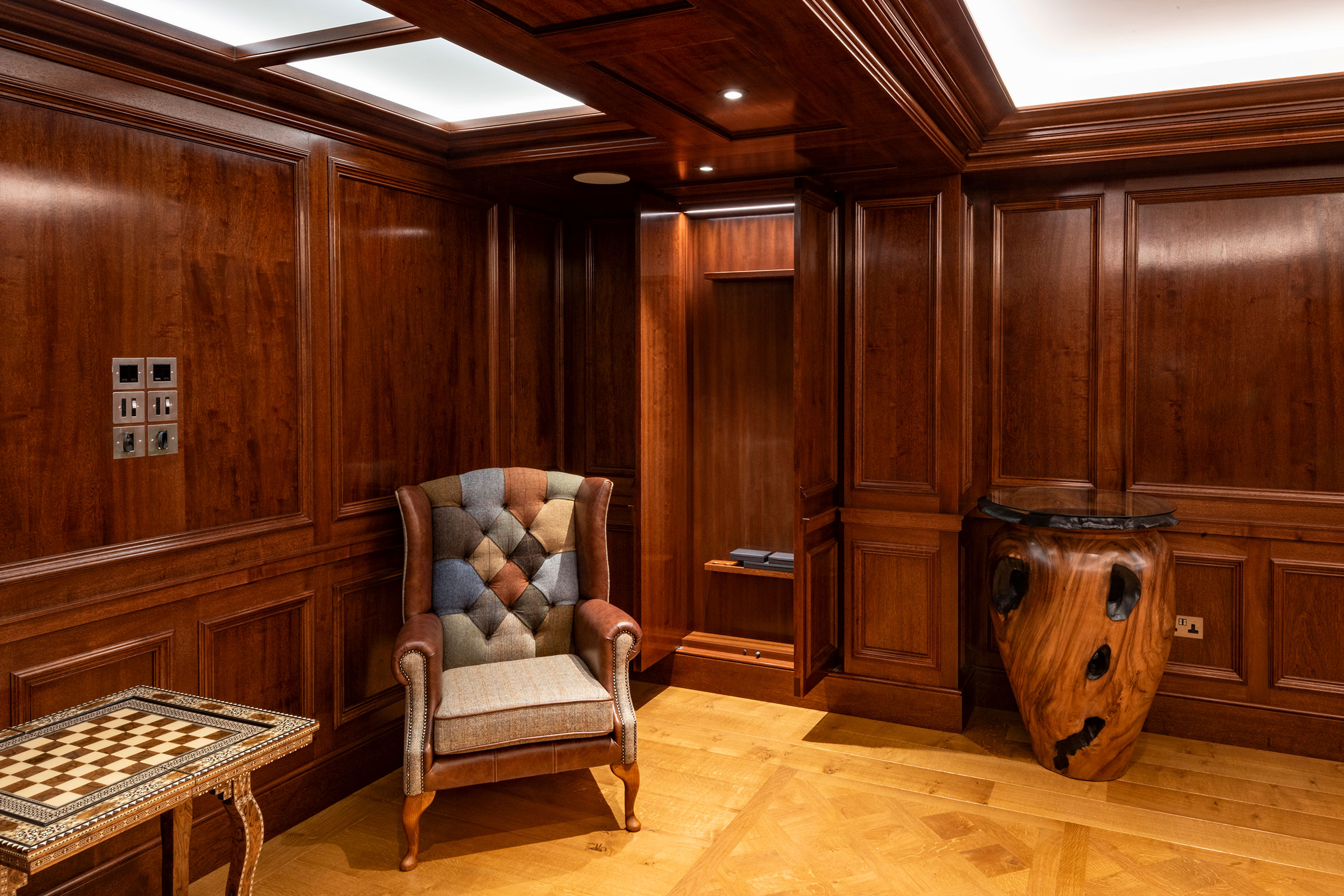 Traditional panelling in african mahoghany for an entertainment space and games room in a London home by William Garvey Bespoke furniture maker and designer