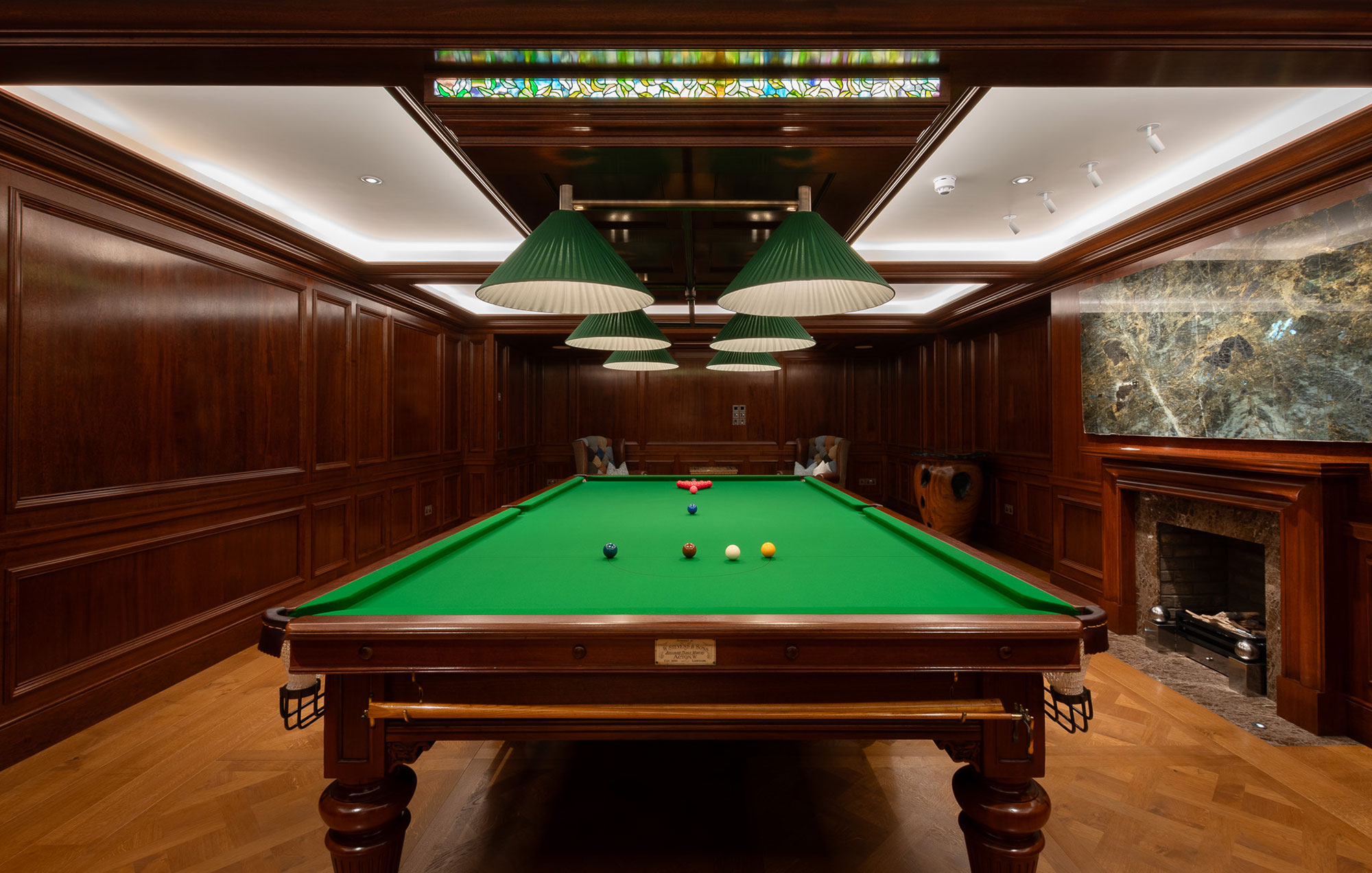 Traditional panelling in african mahoghany for an entertainment space and games room in a London home by William Garvey Bespoke furniture maker and designer
