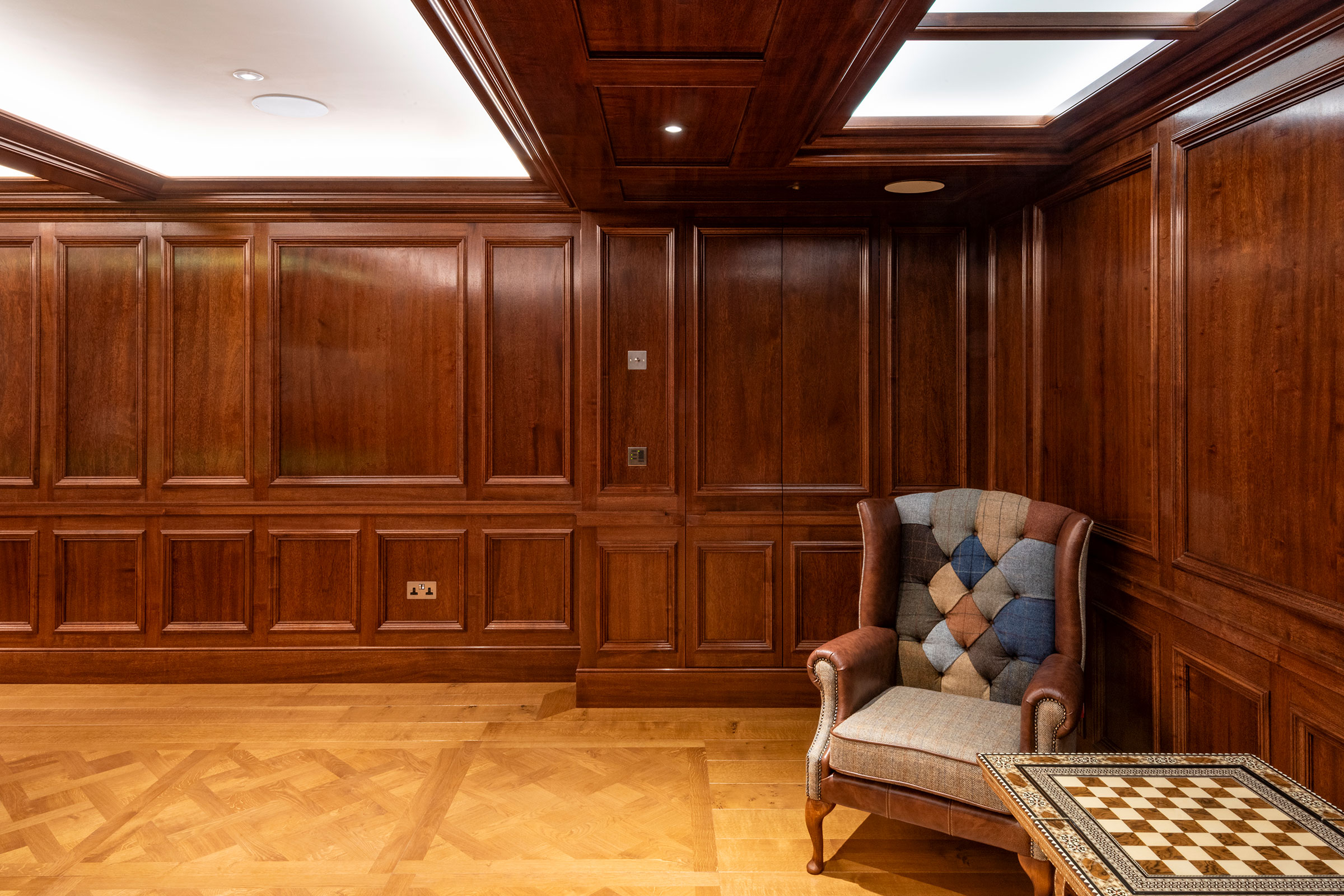 Traditional panelling in african mahoghany for an entertainment space and games room in a London home by William Garvey Bespoke furniture maker and designer