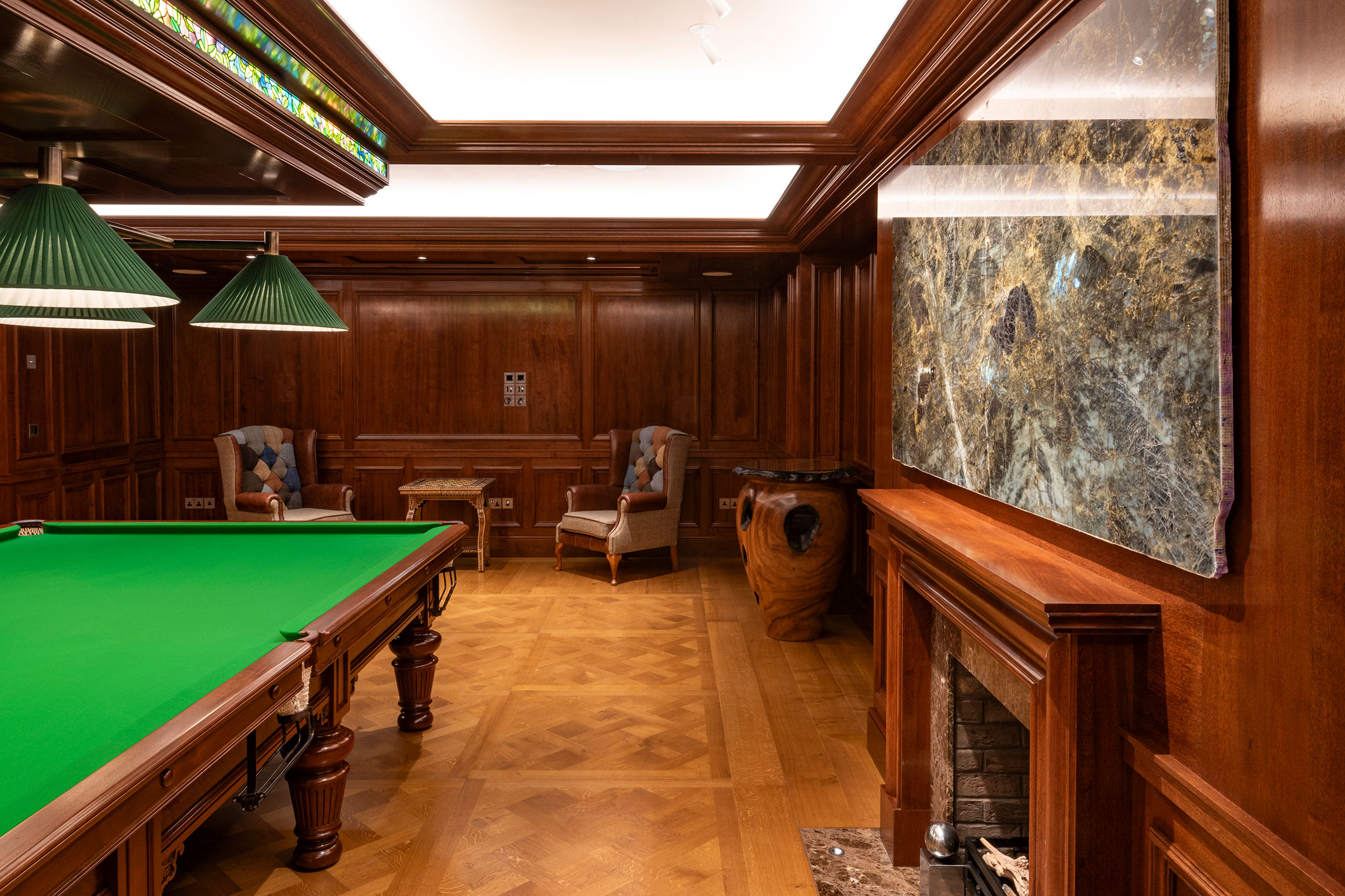 Traditional panelling in african mahoghany for an entertainment space and games room in a London home by William Garvey Bespoke furniture maker and designer
