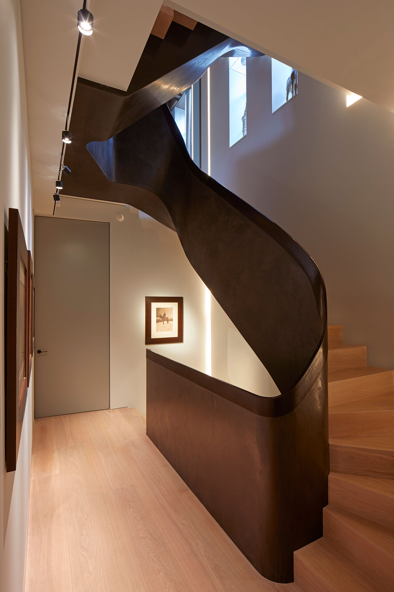 Bespoke staircase with timber treads. Our bespoke cabinetry extended throughout the entirety of this Notting Hill mews property. William Garvey bespoke furniture and cabinet maker