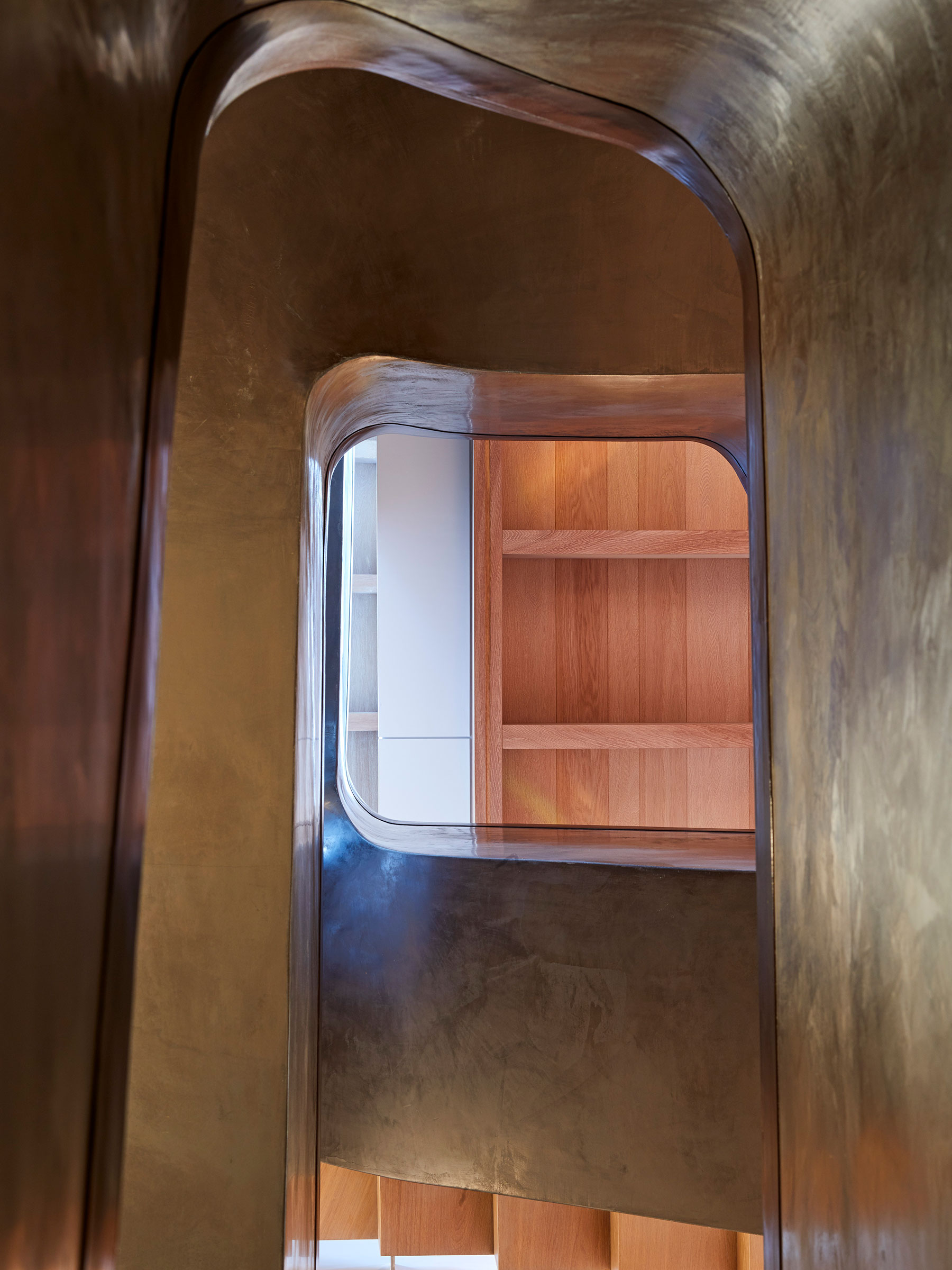 View up the central stairwell. Our bespoke cabinetry extended throughout the entirety of this Notting Hill mews property. William Garvey bespoke furniture and cabinet maker