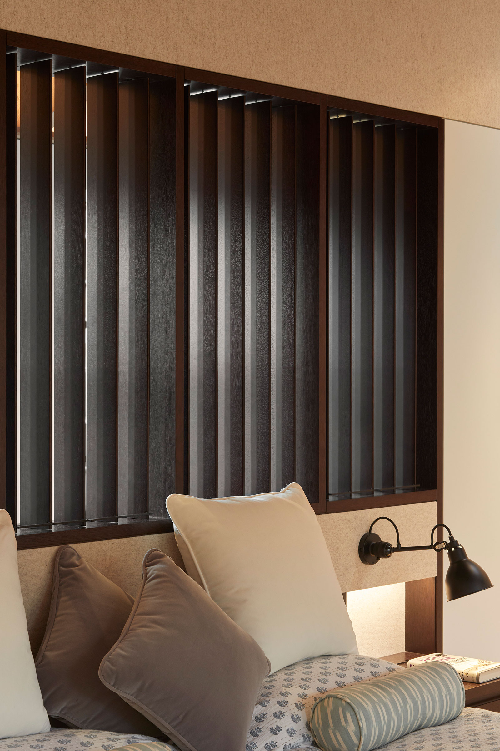 Bespoke headboard in the master suite. Our bespoke cabinetry extended throughout the entirety of this Notting Hill mews property. William Garvey bespoke furniture and cabinet maker