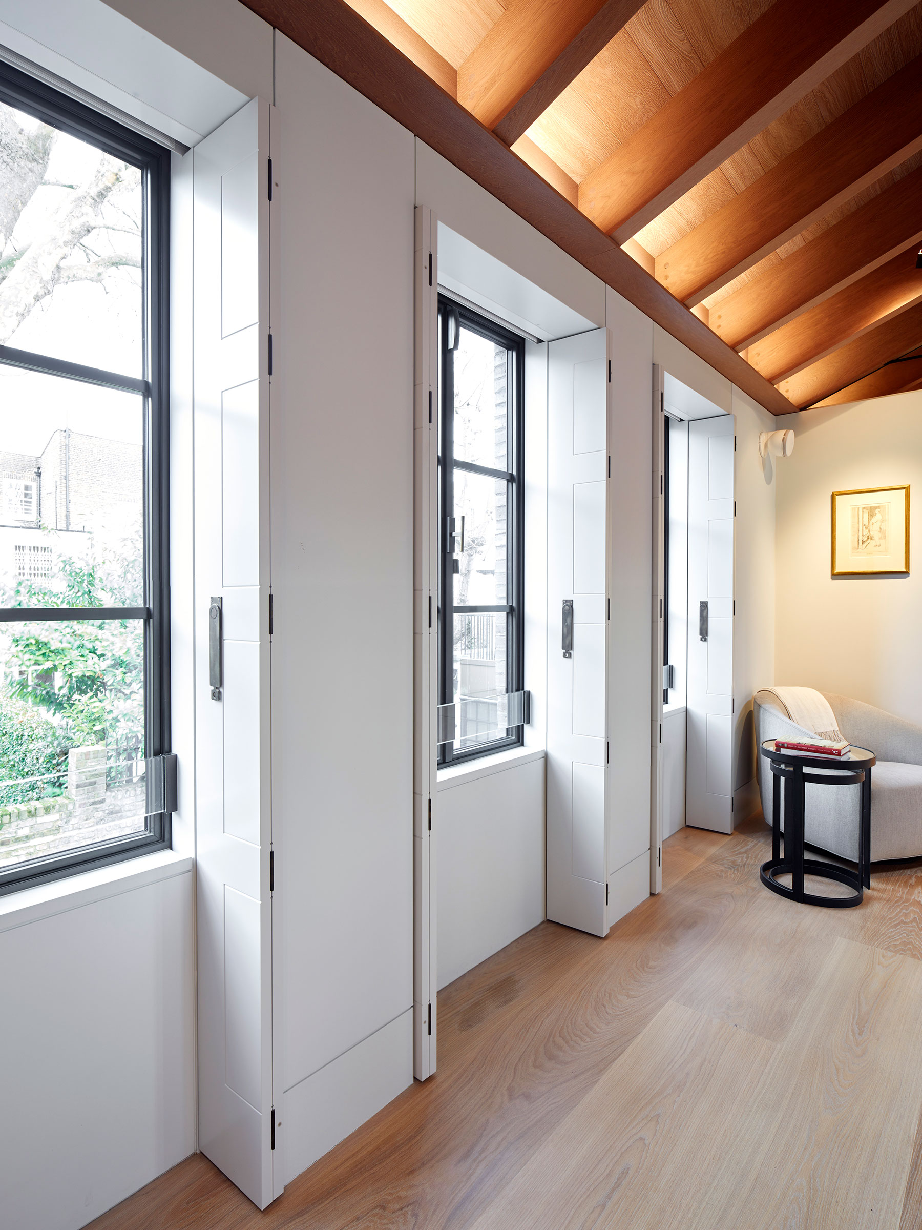 Bespoke shutters and cabinetry in the master suite. Our bespoke cabinetry extended throughout the entirety of this Notting Hill mews property. William Garvey bespoke furniture and cabinet maker