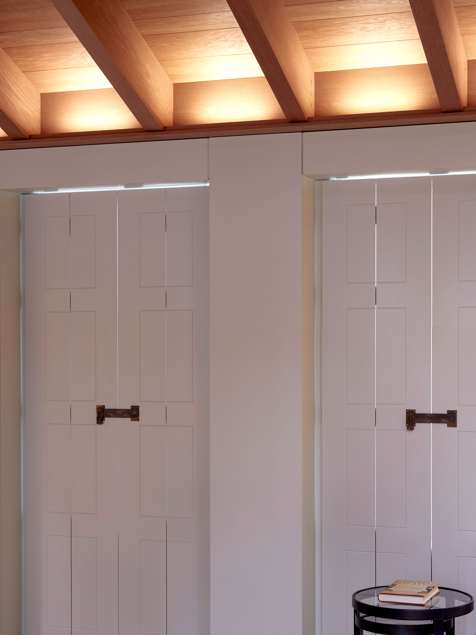Bespoke shutters and cabinetry in the master suite. Our bespoke cabinetry extended throughout the entirety of this Notting Hill mews property. William Garvey bespoke furniture and cabinet maker