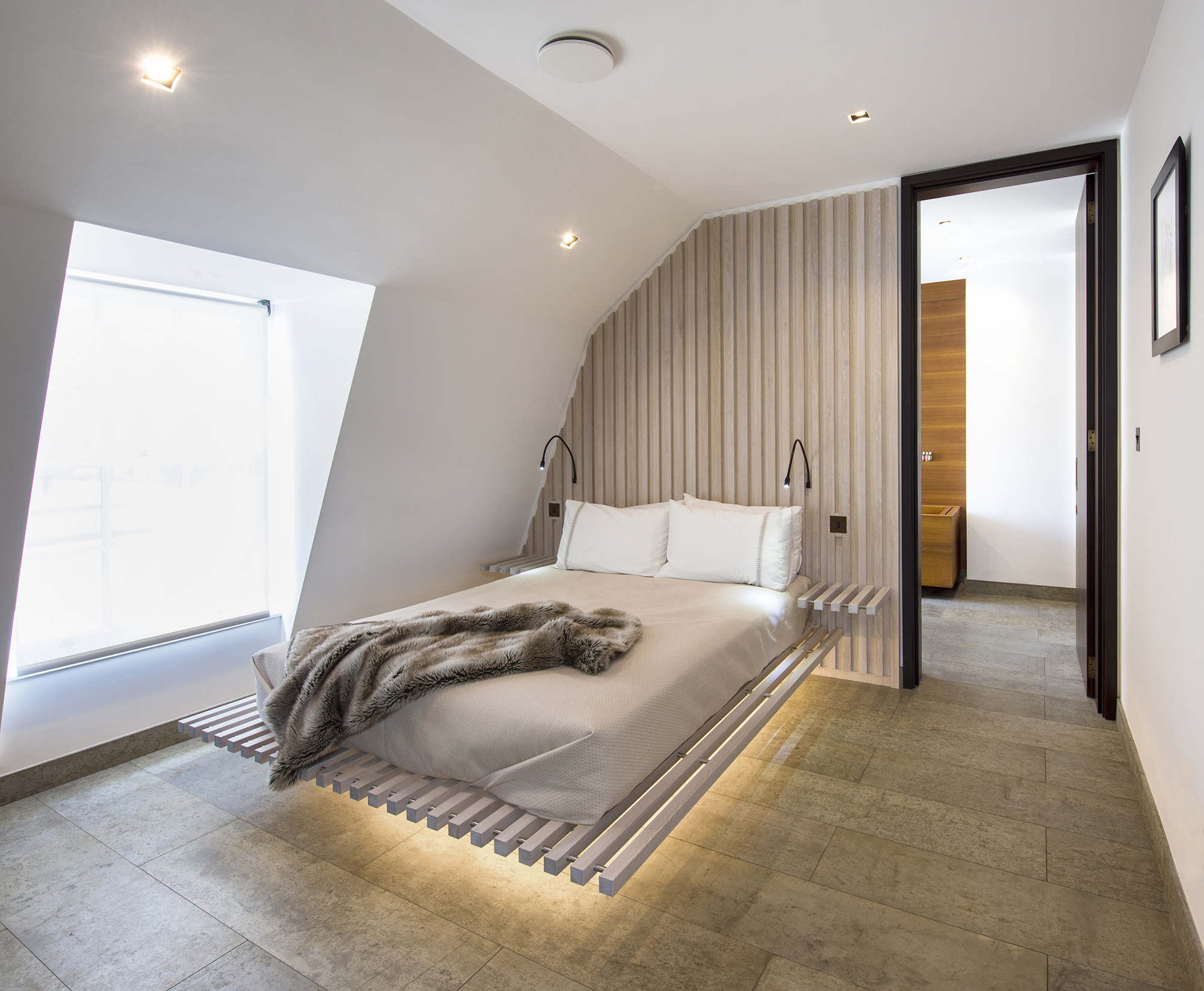 Bespoke limed oak bedroom joinery and furniture for the guest suite of a penthouse in Historic property in Bath all by William Garvey British furniture designers and makers