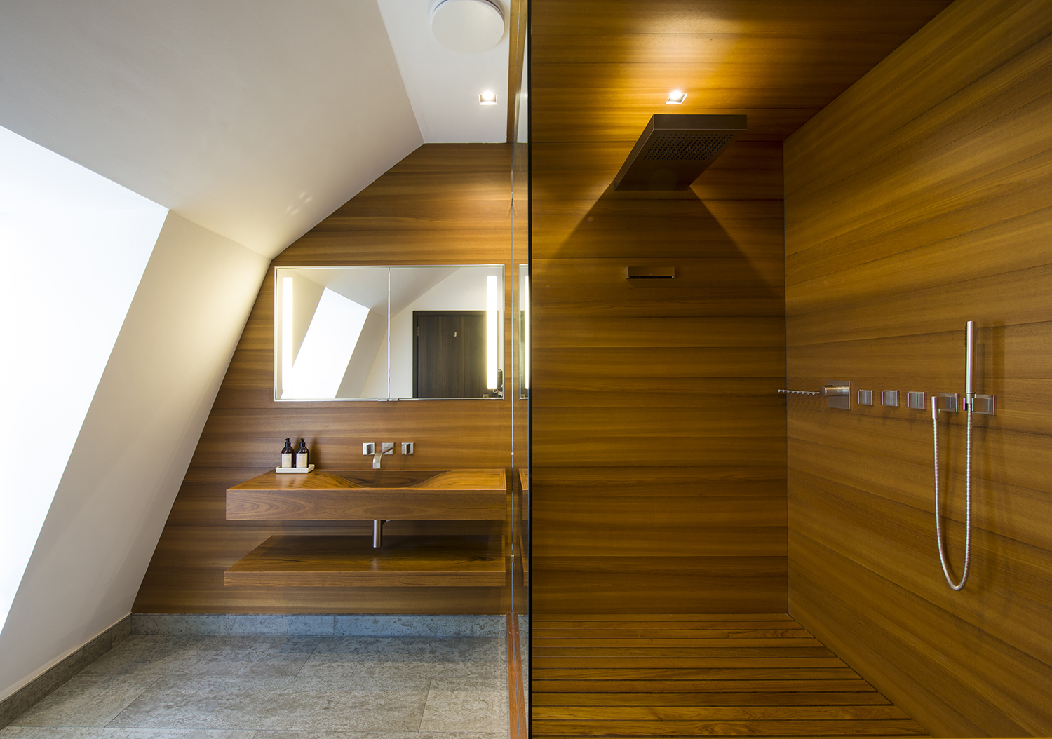 Bespoke waterproof teak bathroom for a master bedroom suite in a penthouse in bath all by William Garvey furniture designers and makers