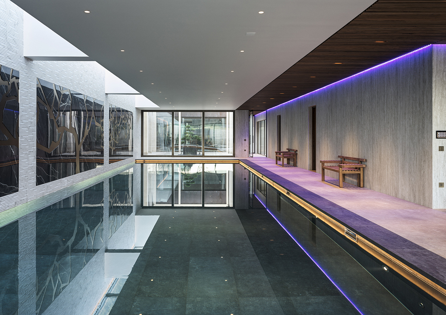 Bespoke waterproof walnut joinery and furniture by William Garvey British furniture designers and makers for the modern extension of a home in Somerset
