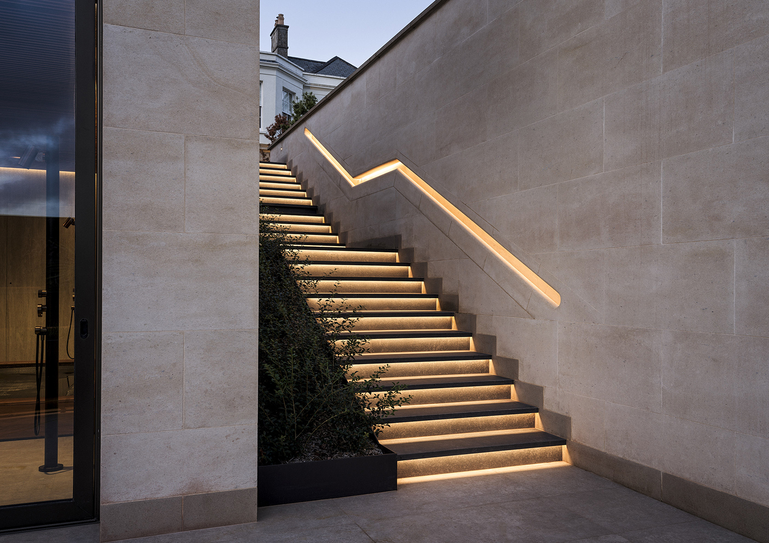 Bespoke waterproof walnut joinery and furniture by William Garvey British furniture designers and makers for the modern extension of a home in Somerset