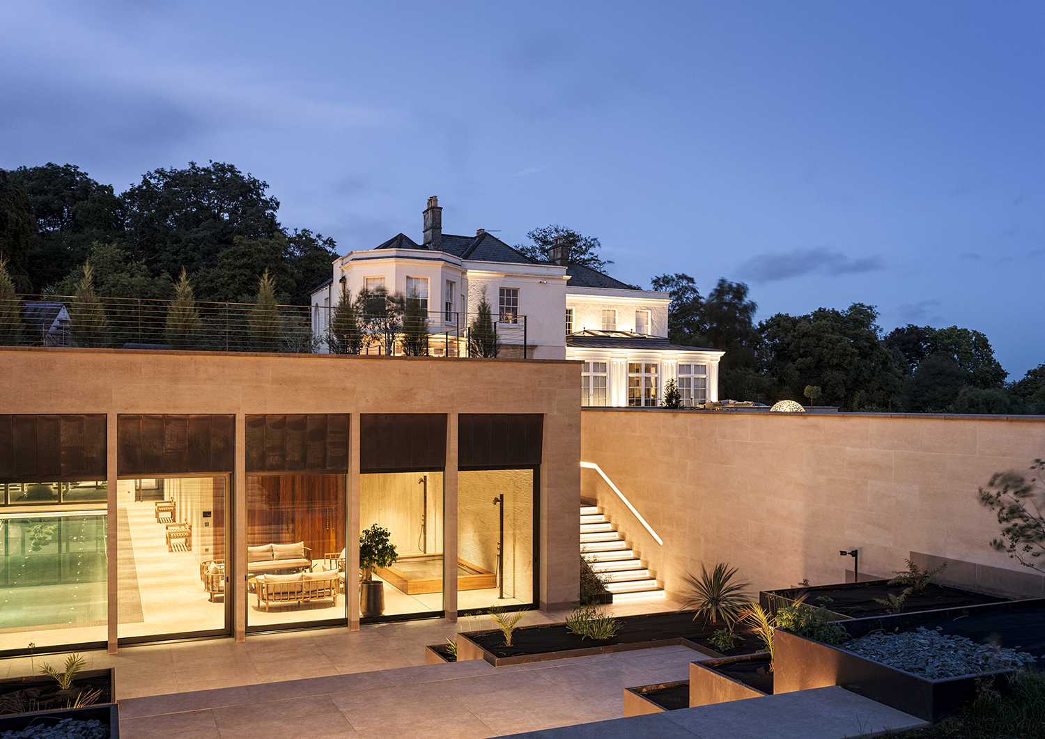Bespoke waterproof walnut joinery and furniture by William Garvey British furniture designers and makers for the modern extension of a home in Somerset