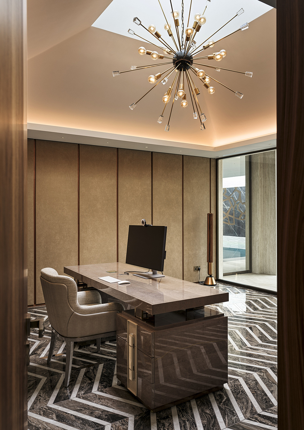 Bespoke walnut and acoustic wall panelling and fitted shelving with leather panels and brass inlays in the home office suite of a listed manor house in Somerset - all bespoke joinery and furniture by William Garvey British furniture designers and makers