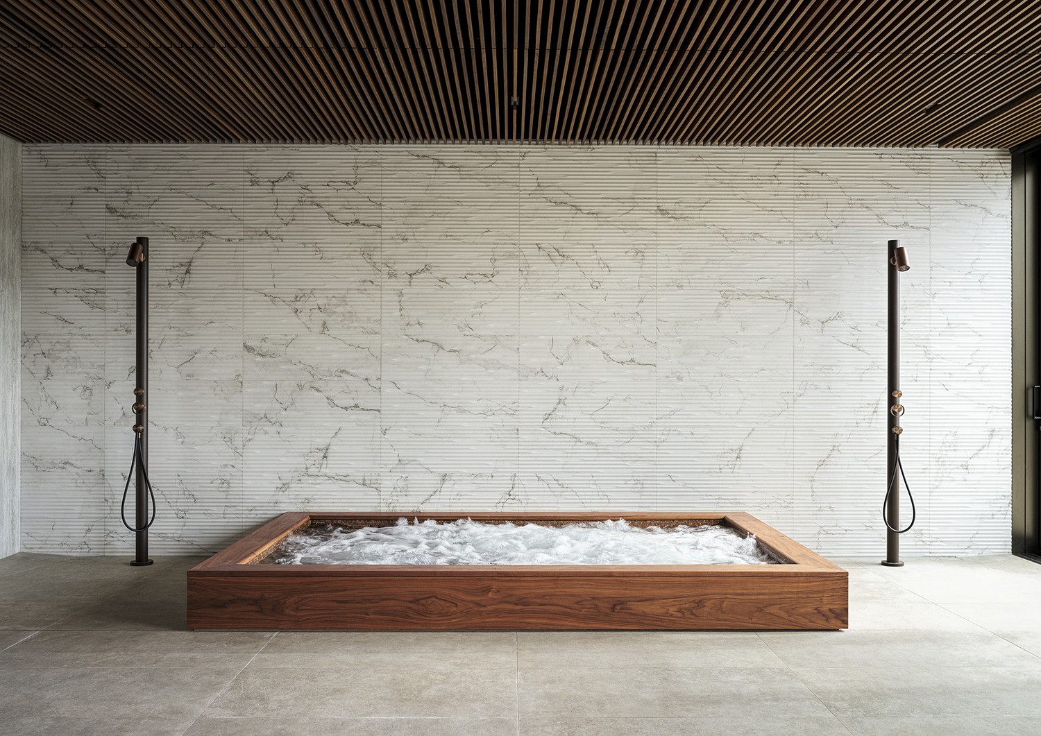 Bespoke jacuzzi surround in walnut in the wellness suite of a listed manor house in Somerset - all bespoke joinery and furniture by William Garvey British furniture designers and makers